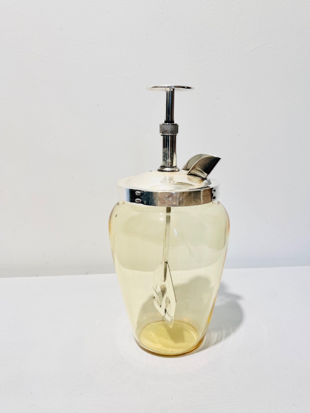 Vintage  pump action cocktail mixer c1930 glass is unusual in that it’s yellow