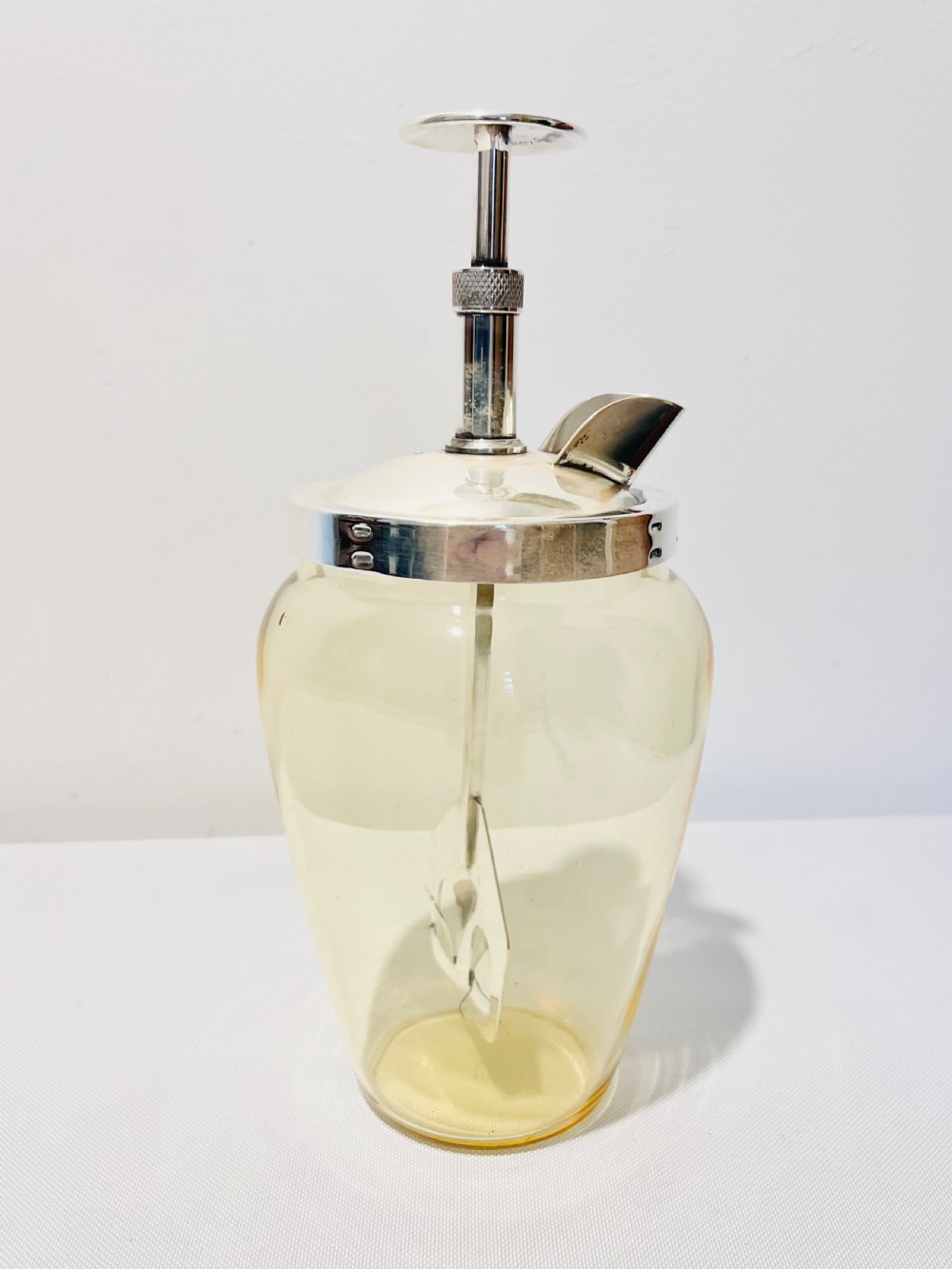 Vintage  pump action cocktail mixer c1930 glass is unusual in that it’s yellow View III