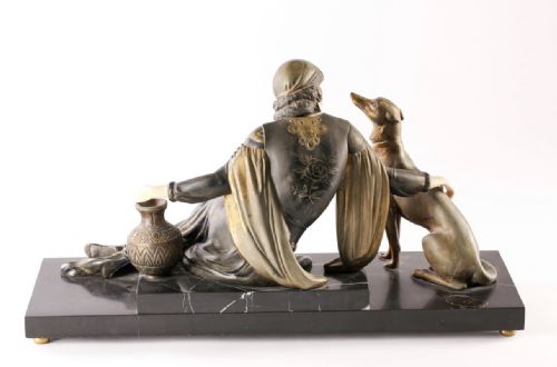 fig 1. An Art Deco figure group by mennivelle C1920-30 depicting a woman seated with her dog