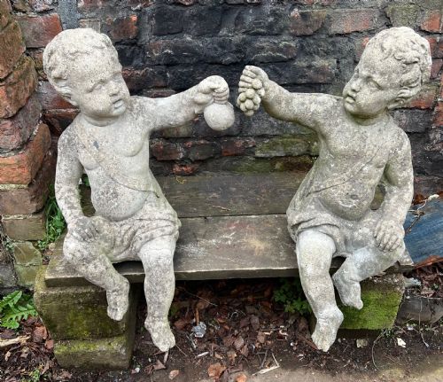 Large Pair of Putti Holding Aloft Fruit