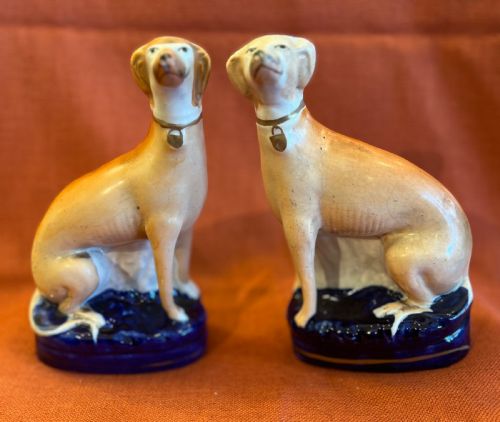 A Pair of Staffordshire Pottery Greyhounds