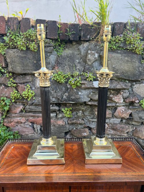 Near Pair of Corinthian Wooden and Brass Table Lamps