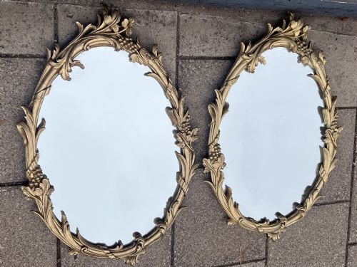 Pair of Carved Giltwood Oval Mirrors