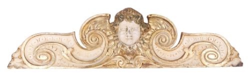 A Large Carved Wooden Over Door Featuring a Cherub 127 Cms Wide