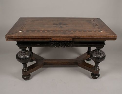 fig 1. A 17th-century Dutch dark oak draw-leaf dining table with geometric inlay on top, carved bulbous legs, and an X-shaped stretcher.
