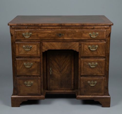 A George II Walnut Kneehole Desk