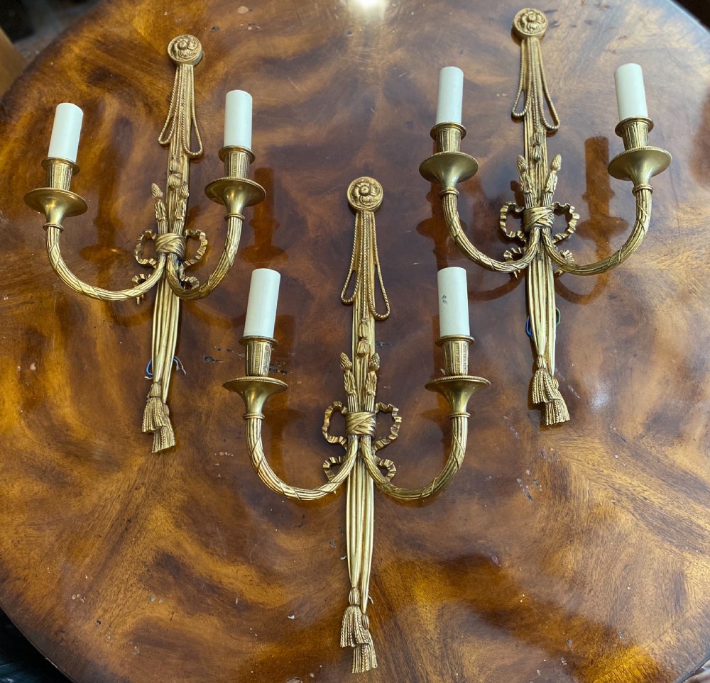 Set of three classical style gilt brass wall lights  View II