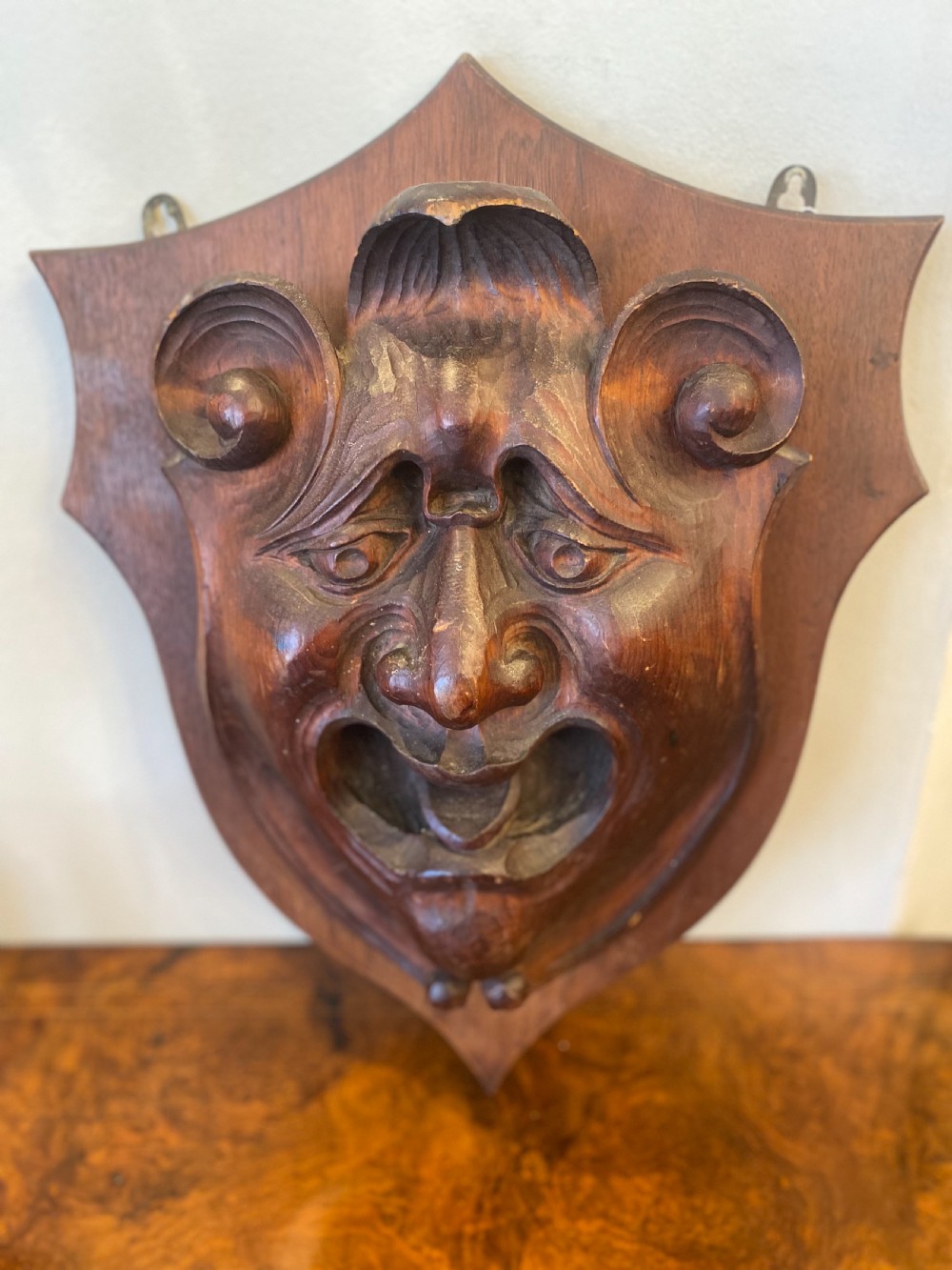 Wall mounted grotesque carved head of large size 