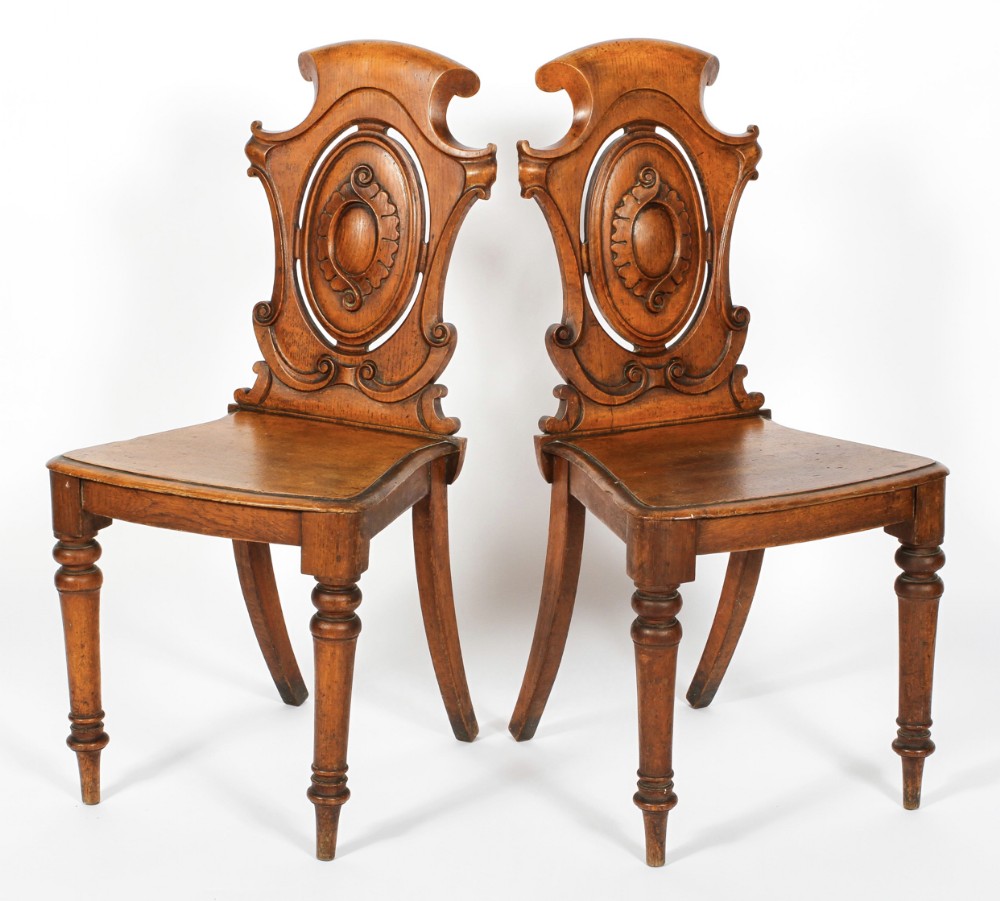 Pair of light oak hall chairs 