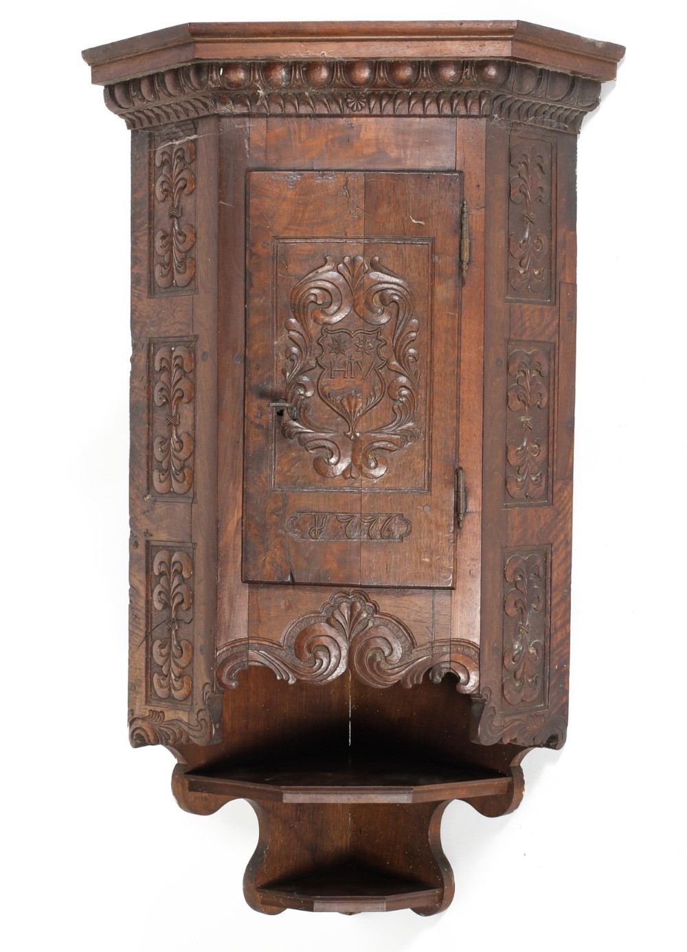 C18th continental walnut carved corner cupboard 
