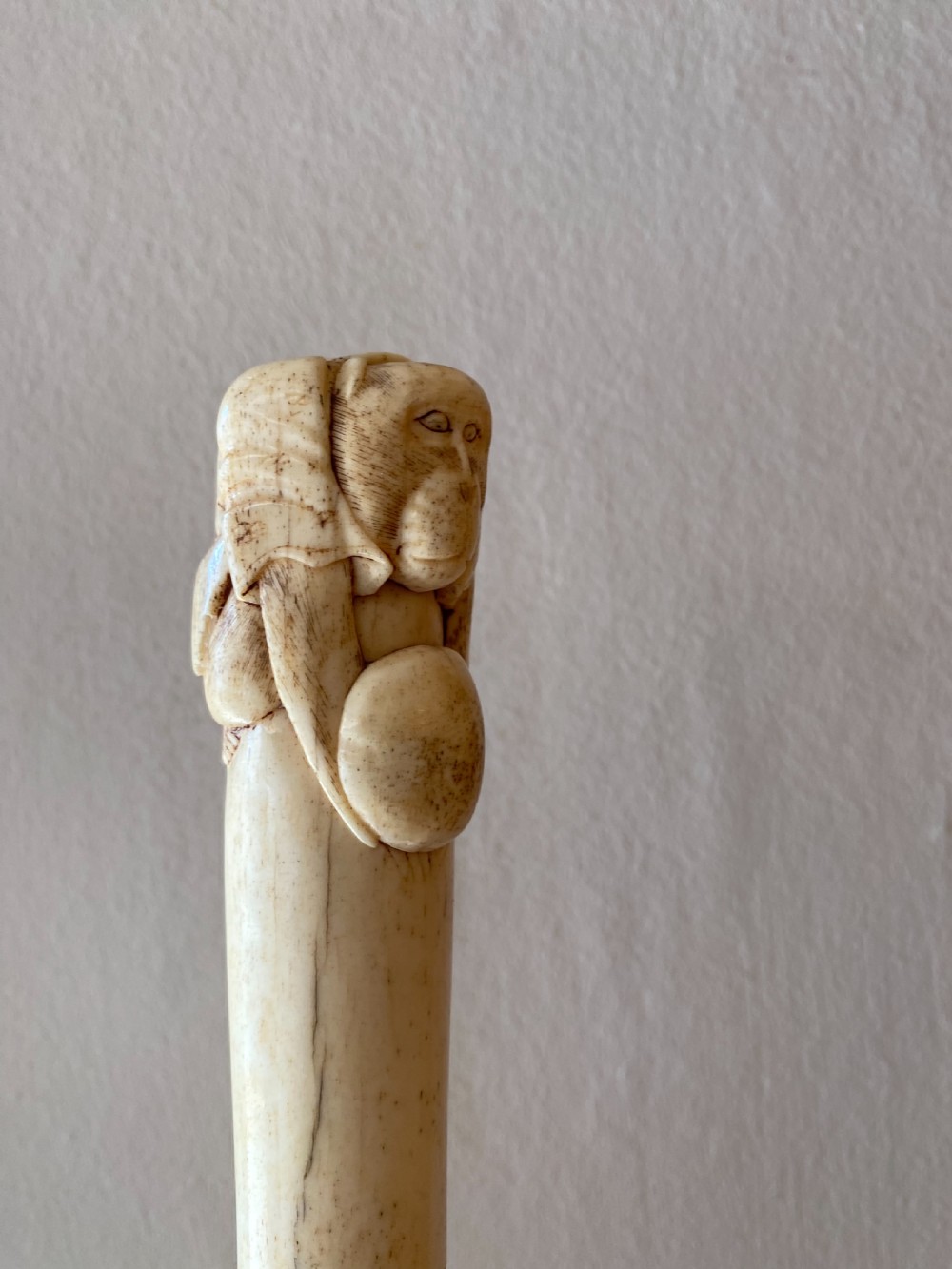 C19th Chinese bone walking stick with carved monkey holding a ball  View IV