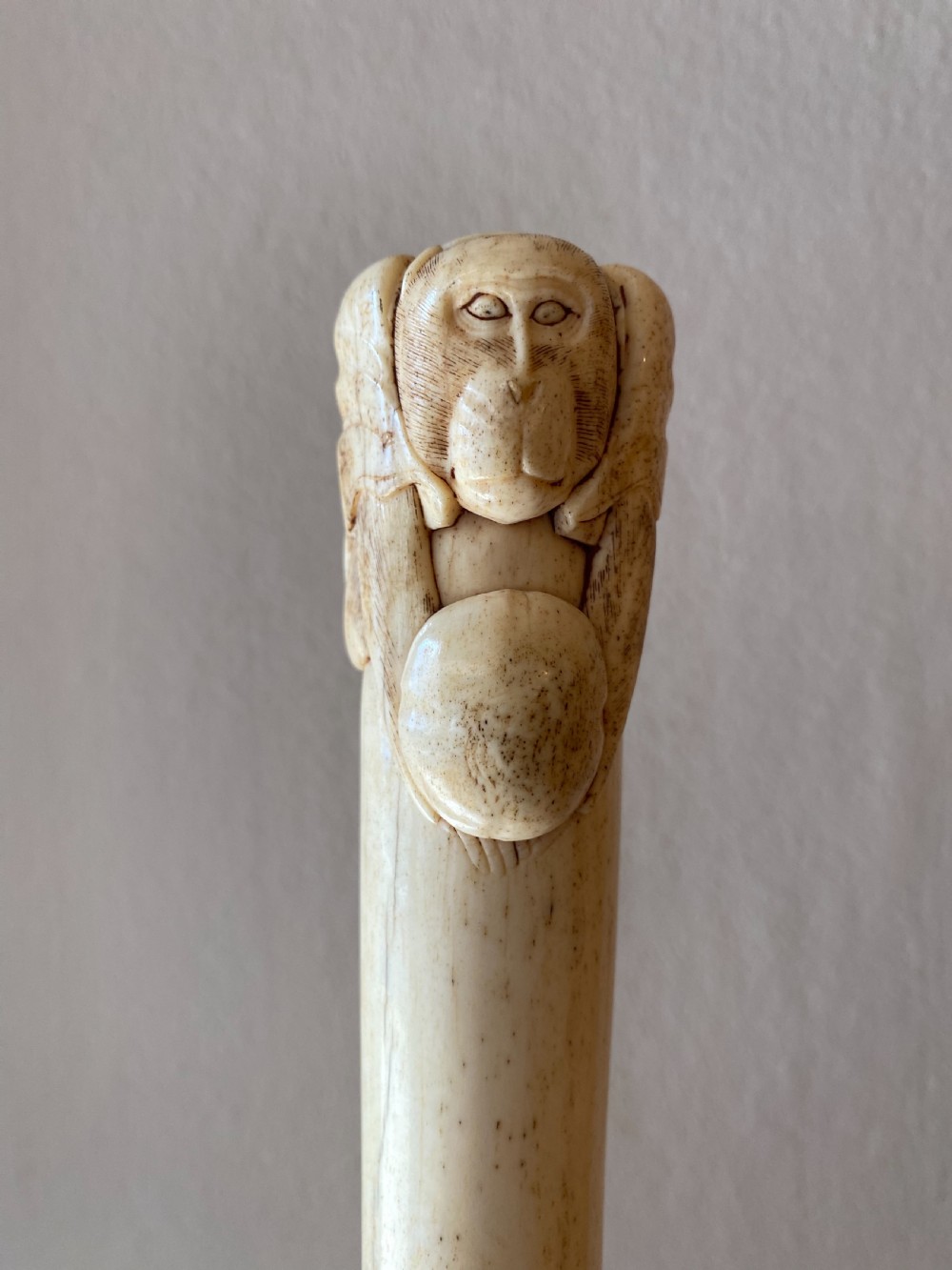 C19th Chinese bone walking stick with carved monkey holding a ball  View V