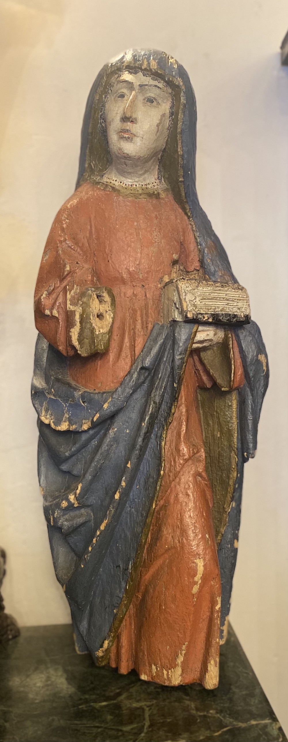 A large C15th carved lime wood figure of a lady 