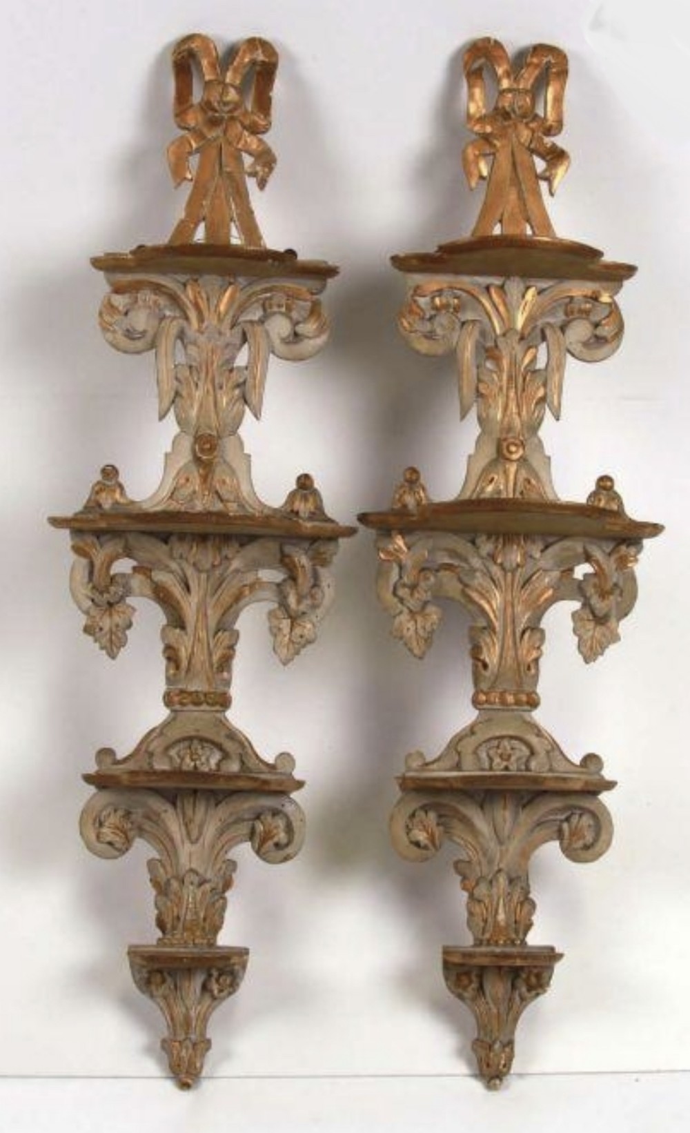 Pair of regency painted and gilded appliqué shelves 