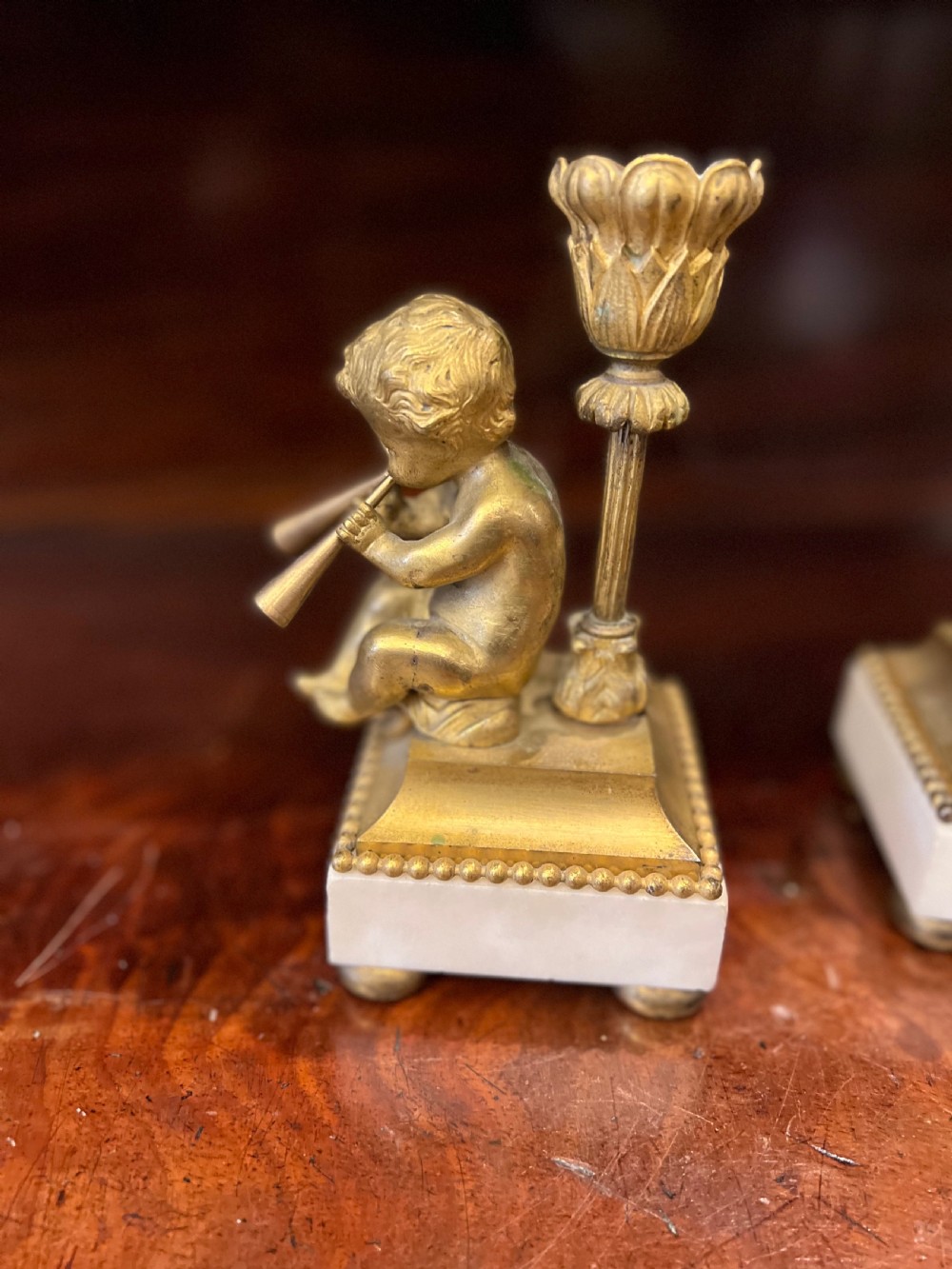 Pair of bronze ormolu cherub candlesticks  View II