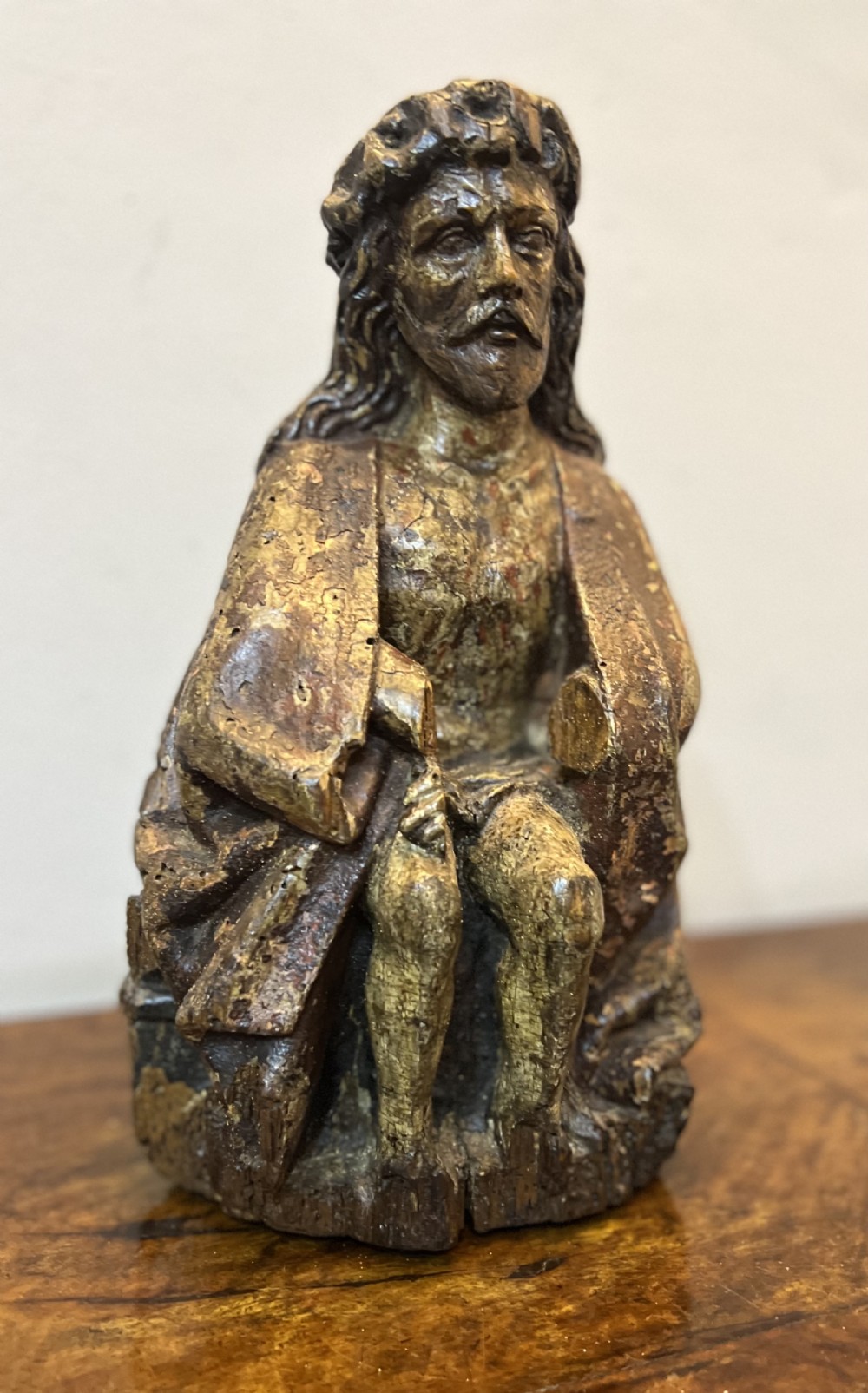 C1450 carved wood polychrome painted Christ sat on the cold stone 