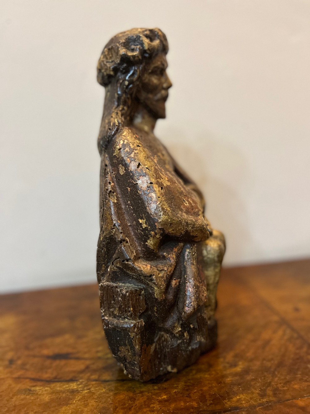 C1450 carved wood polychrome painted Christ sat on the cold stone  View V