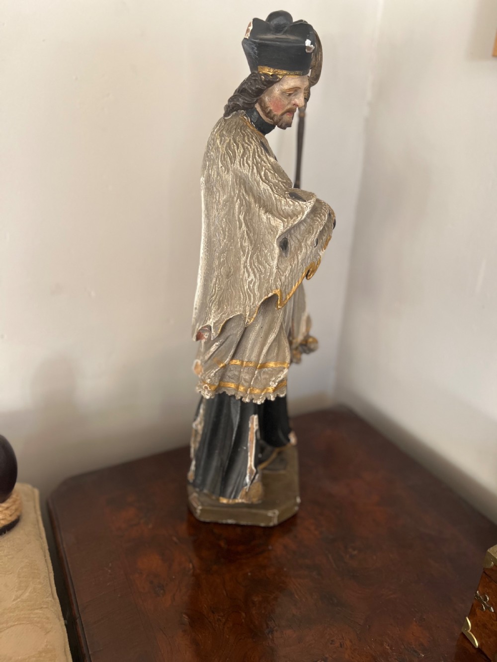 An 18th-century German carved polychrome wood figure depicting Saint John Nepomuk holding a crosier. View VI