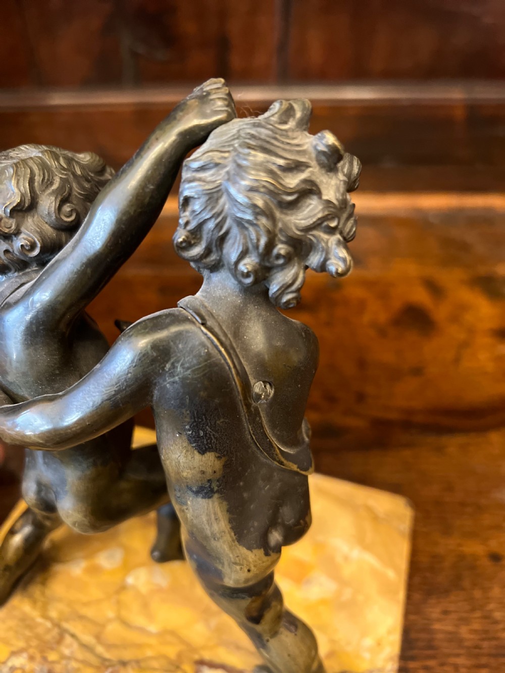 Bronze group of fighting cherubs on sienna marble base  View II