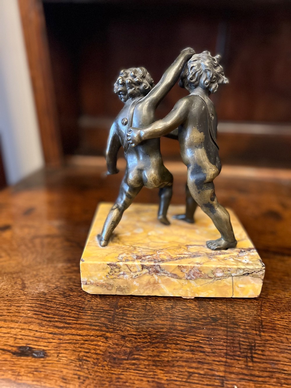 Bronze group of fighting cherubs on sienna marble base  View VI