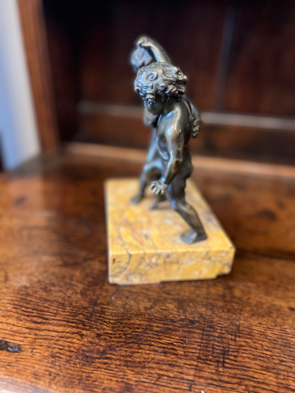 Bronze group of fighting cherubs on sienna marble base  View VII