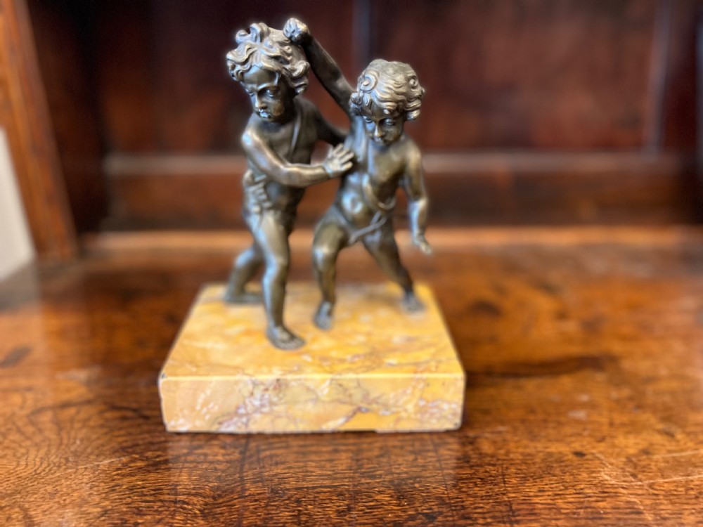 Bronze group of fighting cherubs on sienna marble base  View IX
