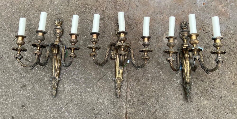 Set of large three armed wall lights 