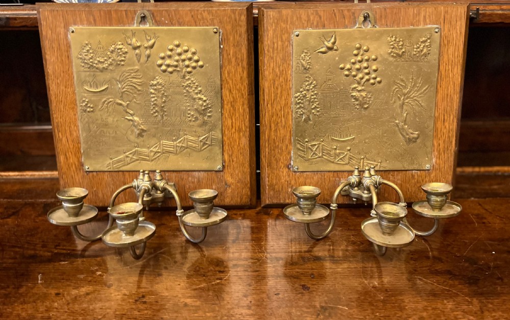 Arts and crafts oak and brass three armed wall sconce 