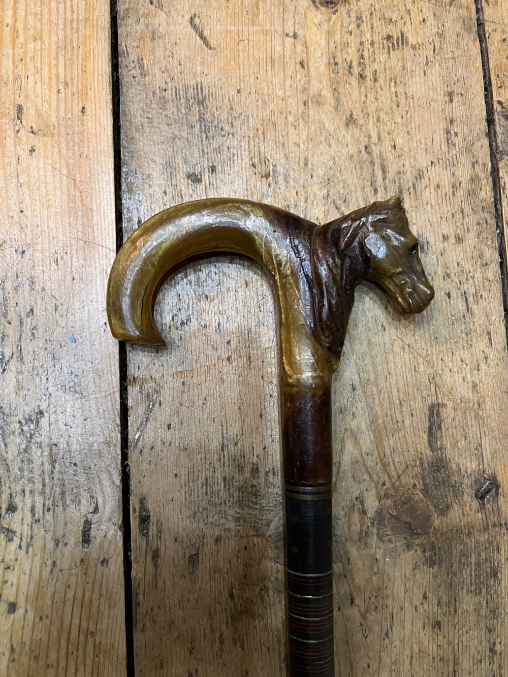 Horn handles walking stick with carved horses head