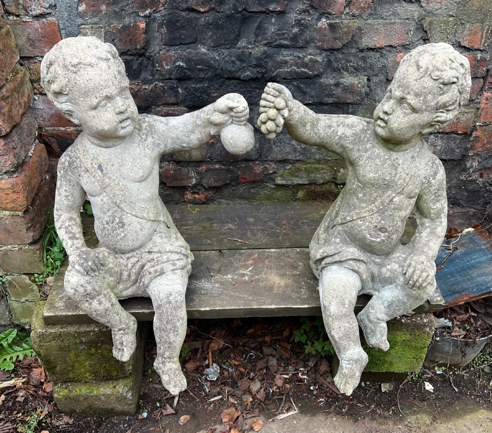 Large pair of putti holding aloft fruit  View III