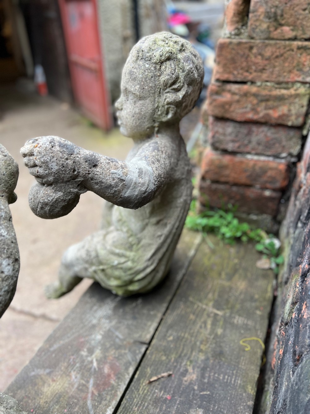 Large pair of putti holding aloft fruit  View X