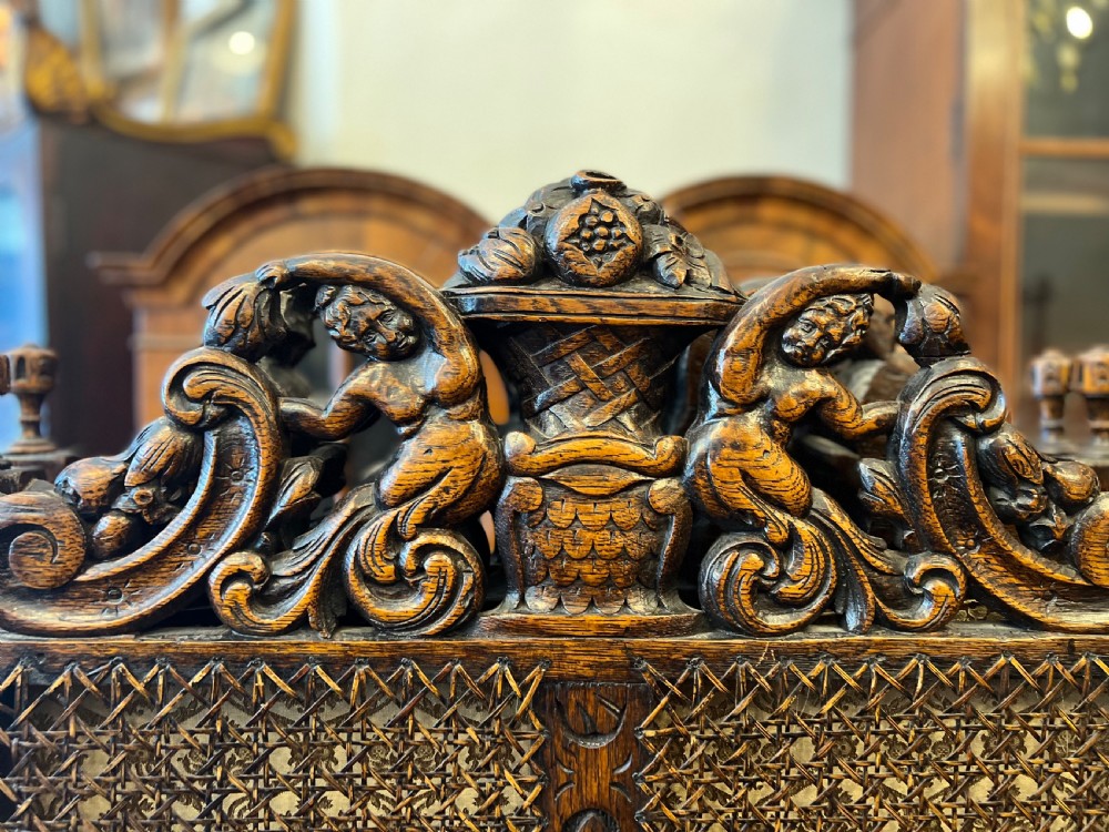 C19th oak and tooled leather room divider in tooled leather and carved  View VIII