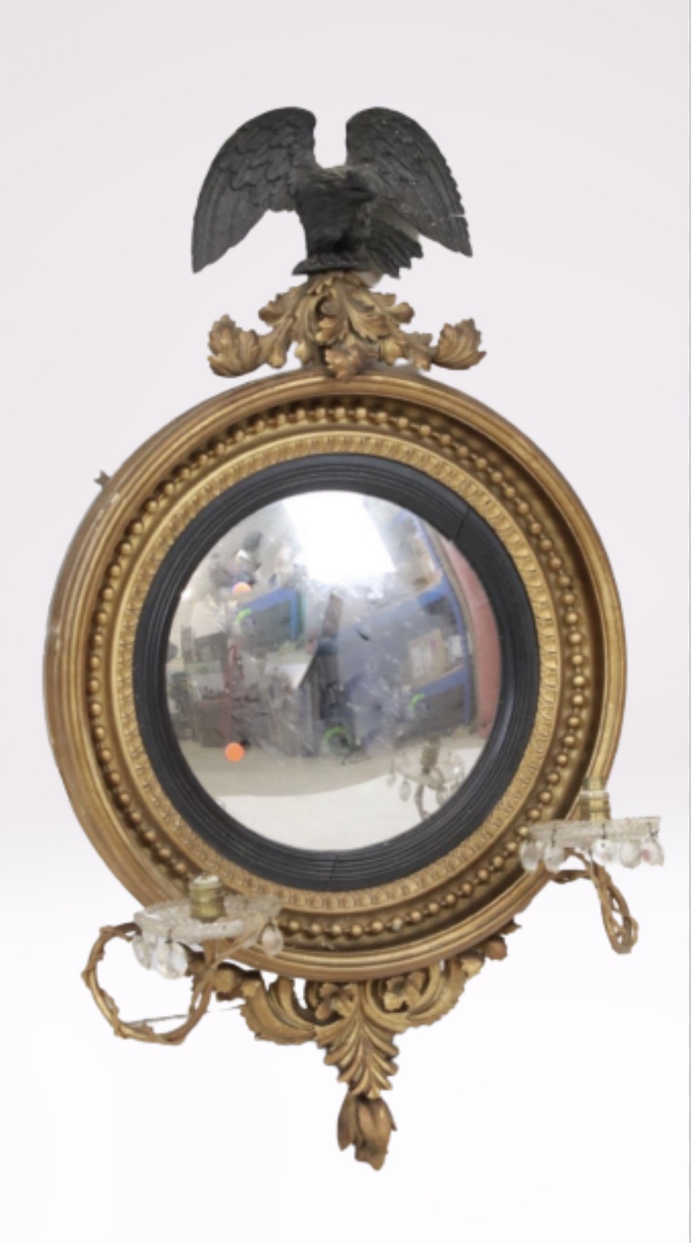 Regency carved giltwood convex mirror