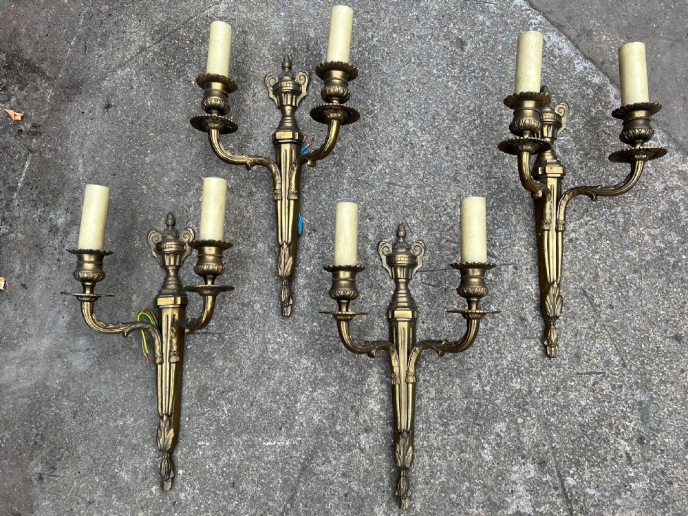 Set of four brass wall lights in the adams style 
