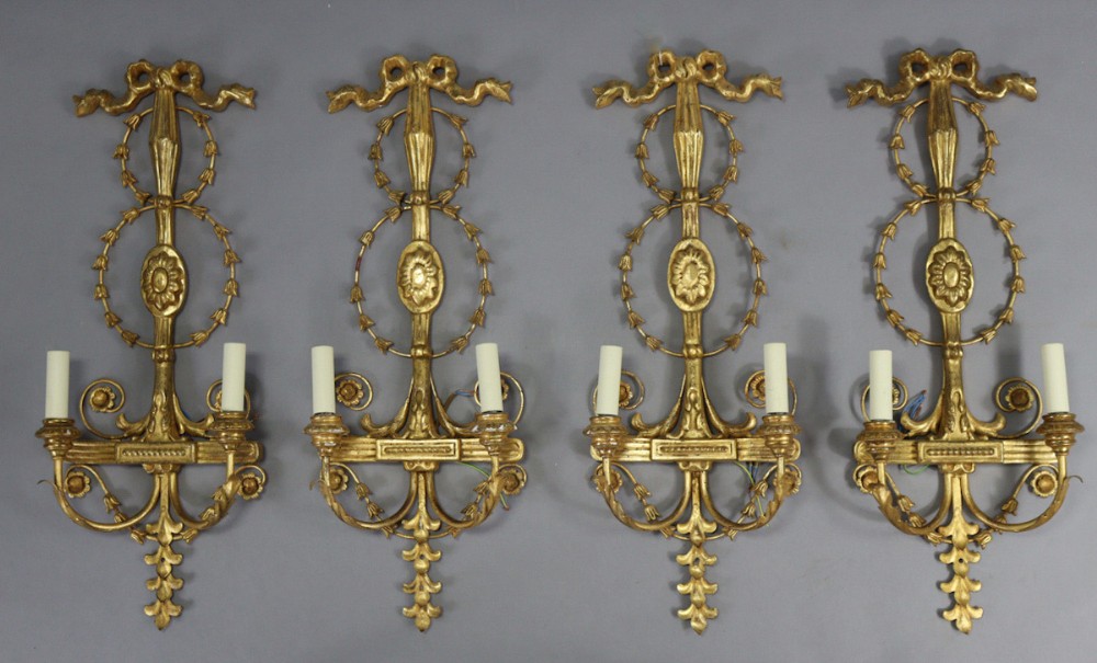 Set of classical adams style giltwood and gilt metal wall lights 