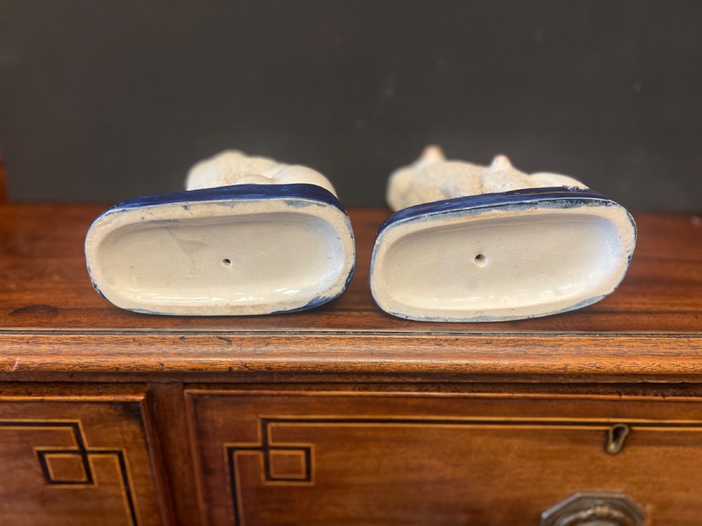 Pair of Staffordshire pottery poodles sat with their puppies  View II