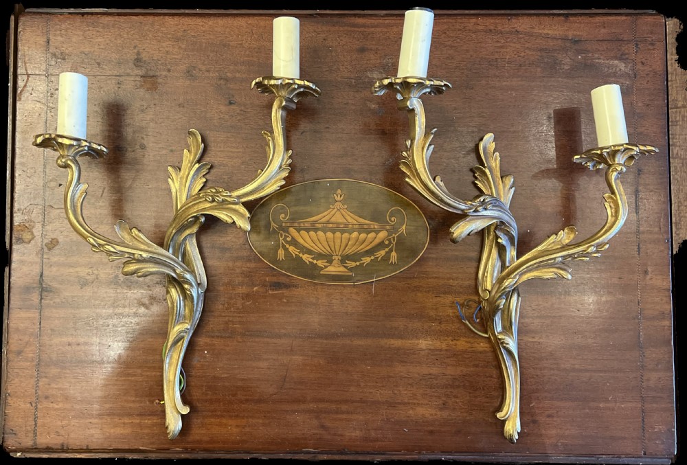 Pair of rococo wall lights in brass 