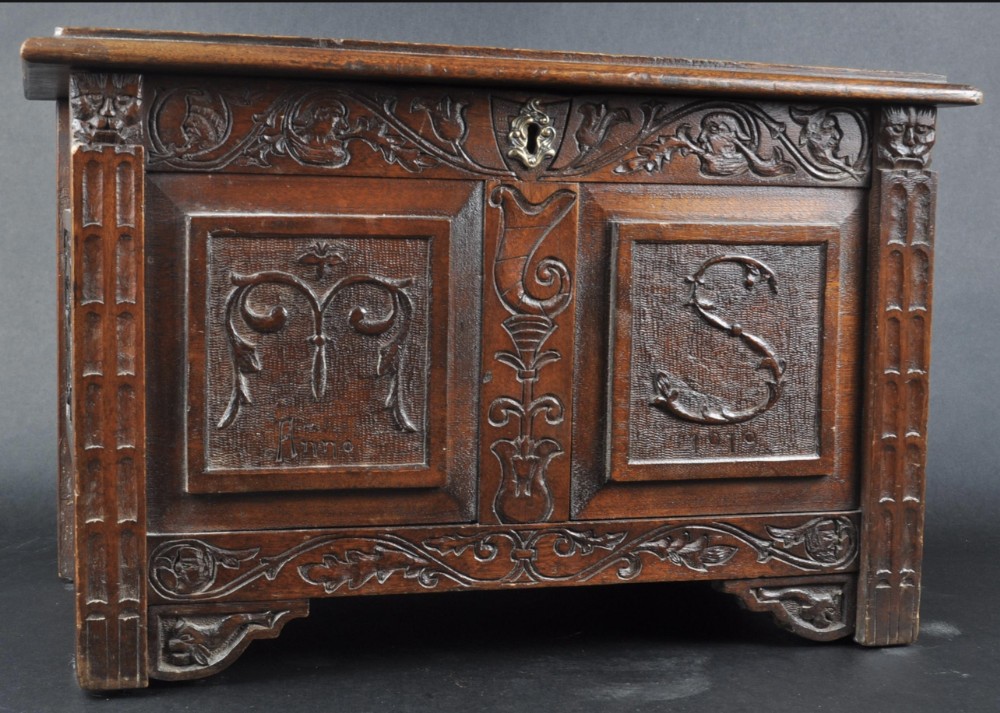 A carved small oak box 