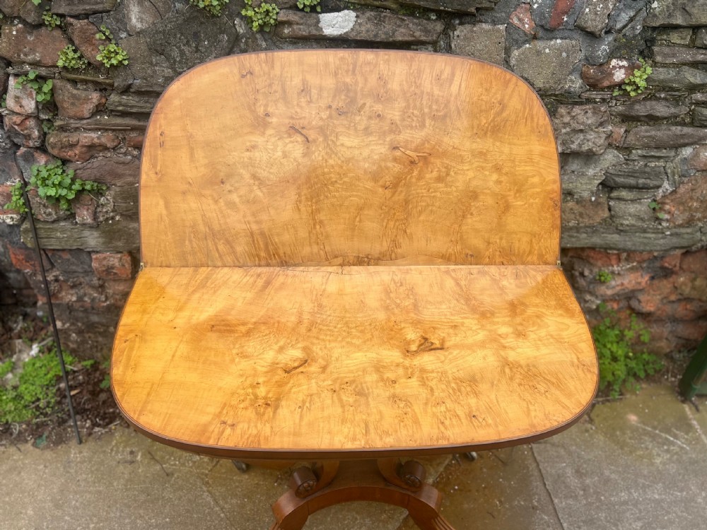 A regency tea table mahogany and yew wood inlaid top  View II