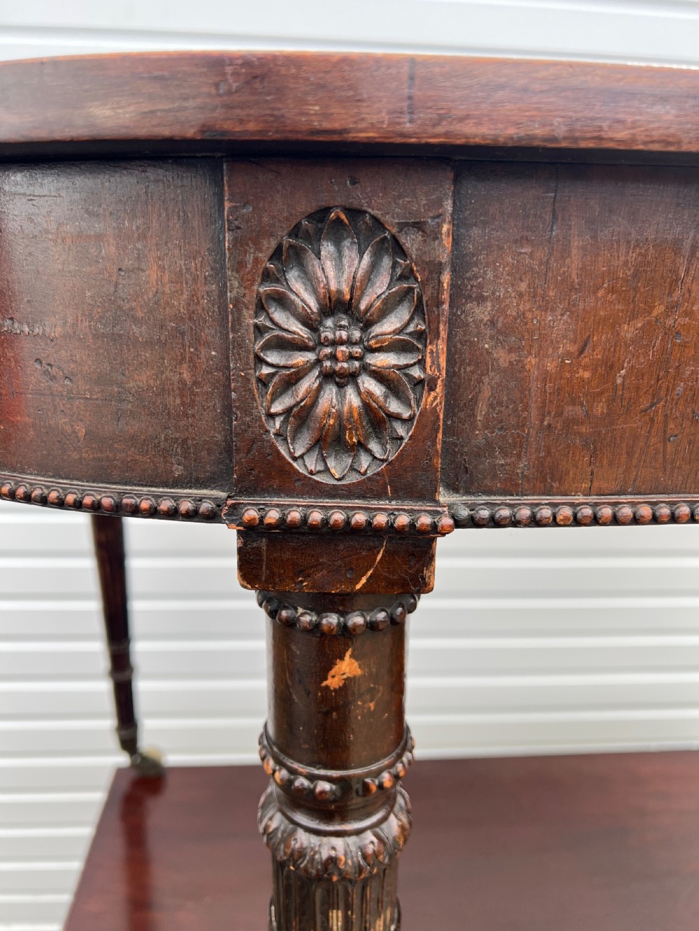 A pair of c1800 D end tables with ribbon swag carving and paterae View II