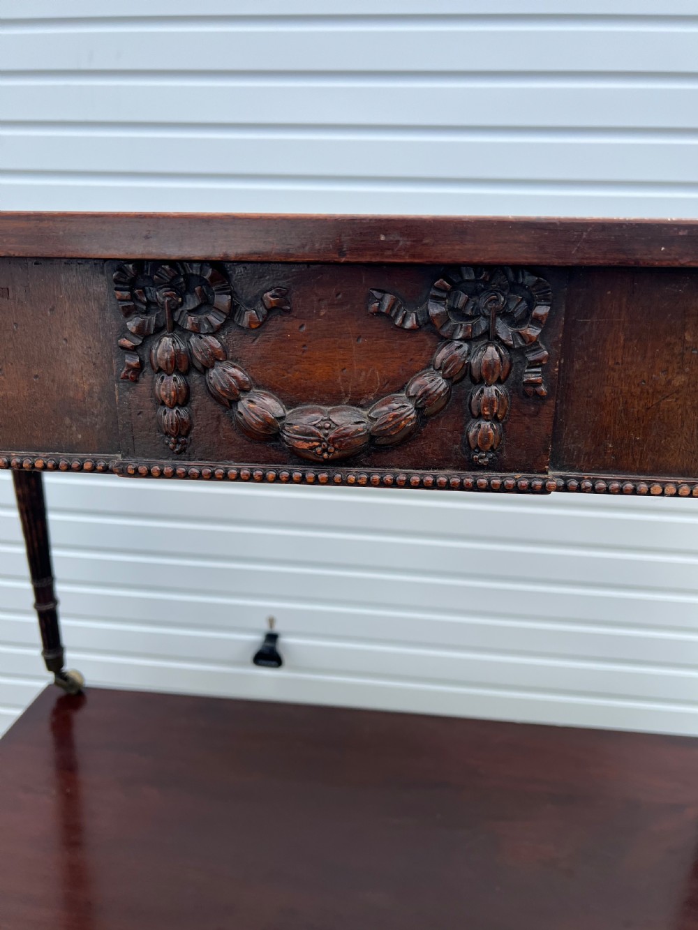 A pair of c1800 D end tables with ribbon swag carving and paterae View IV