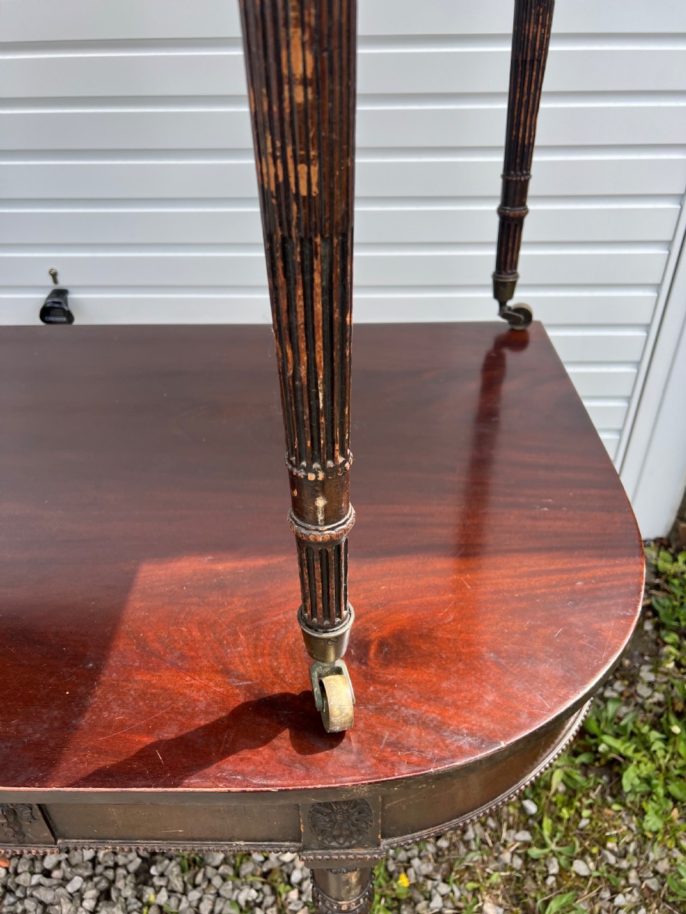 A pair of c1800 D end tables with ribbon swag carving and paterae View V