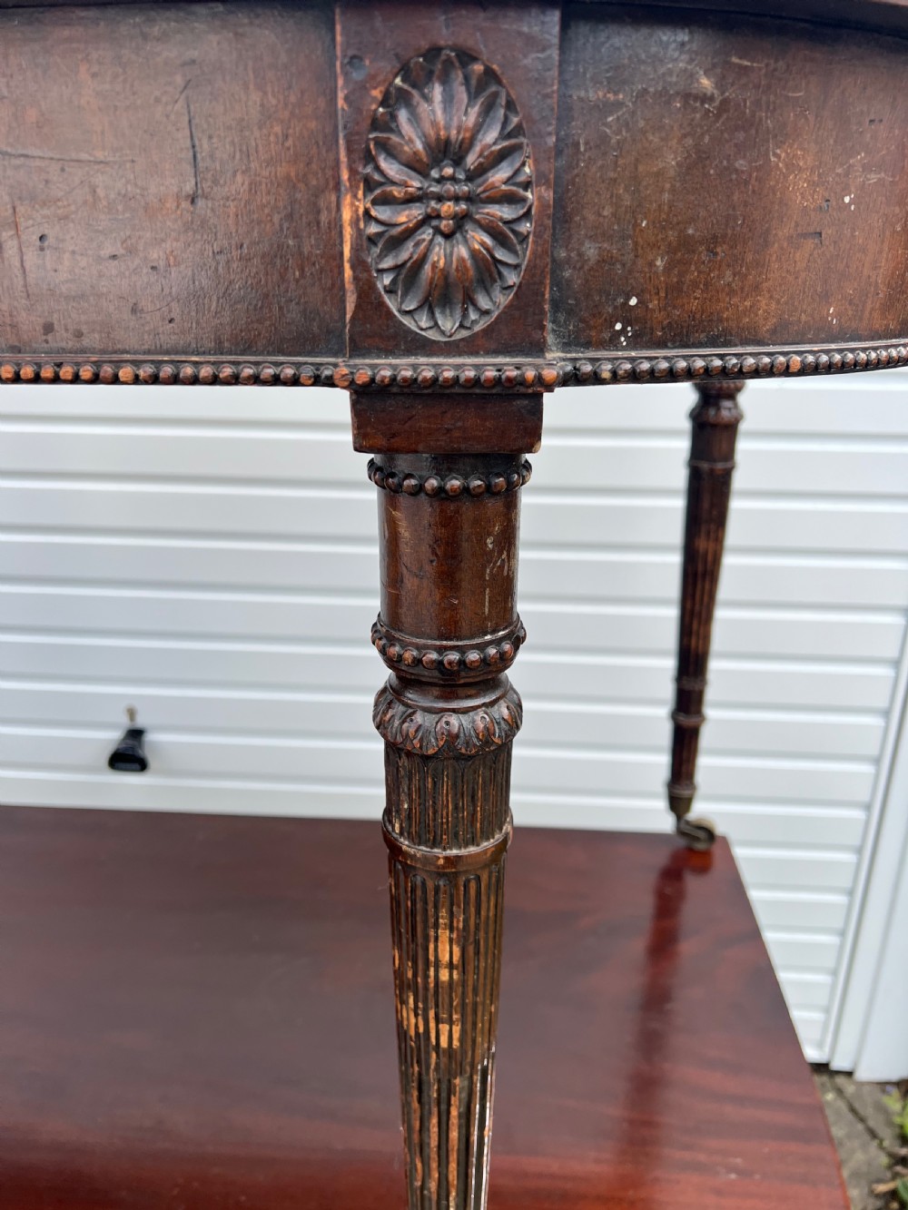 A pair of c1800 D end tables with ribbon swag carving and paterae View VI