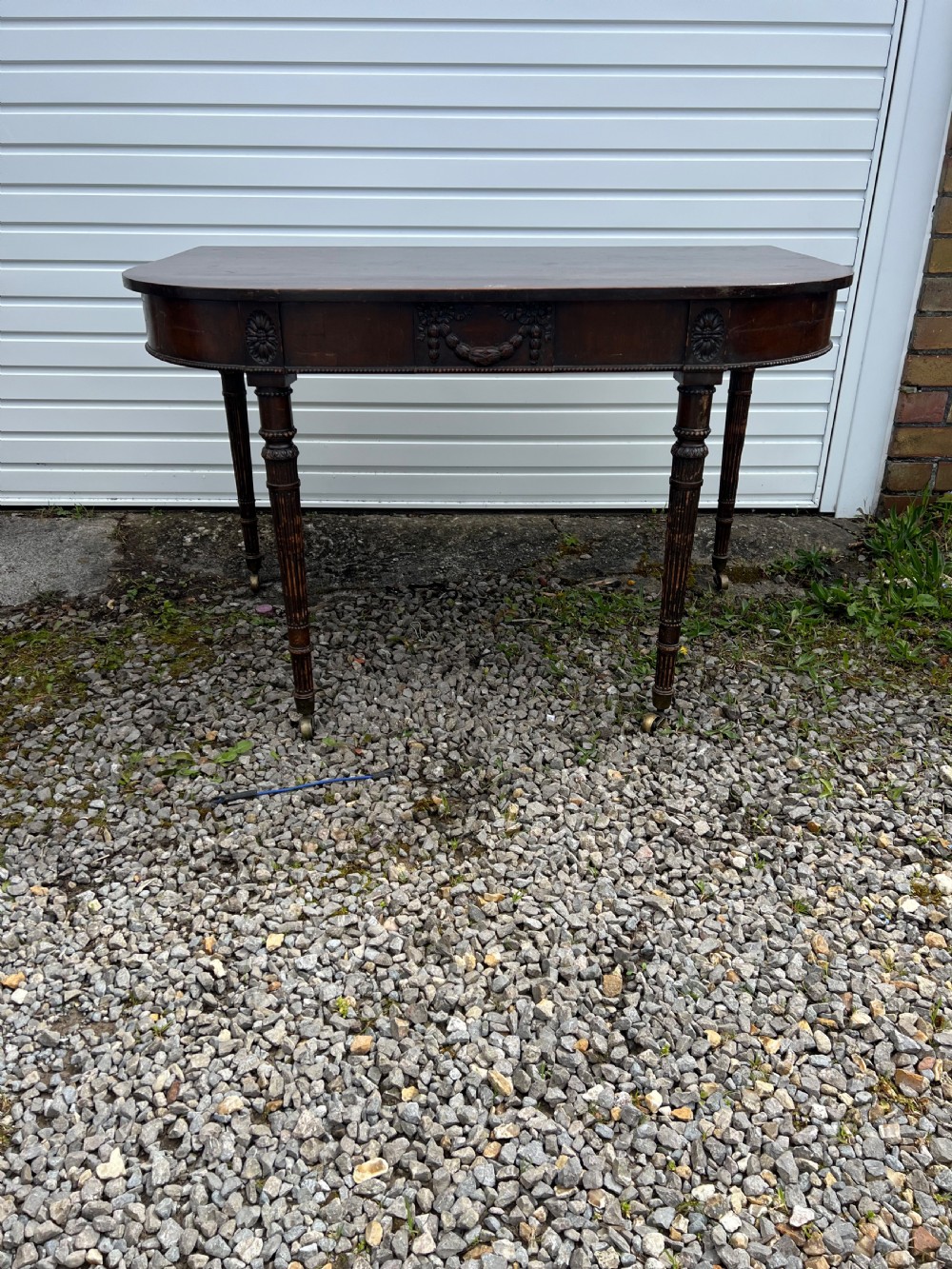 A pair of c1800 D end tables with ribbon swag carving and paterae View X