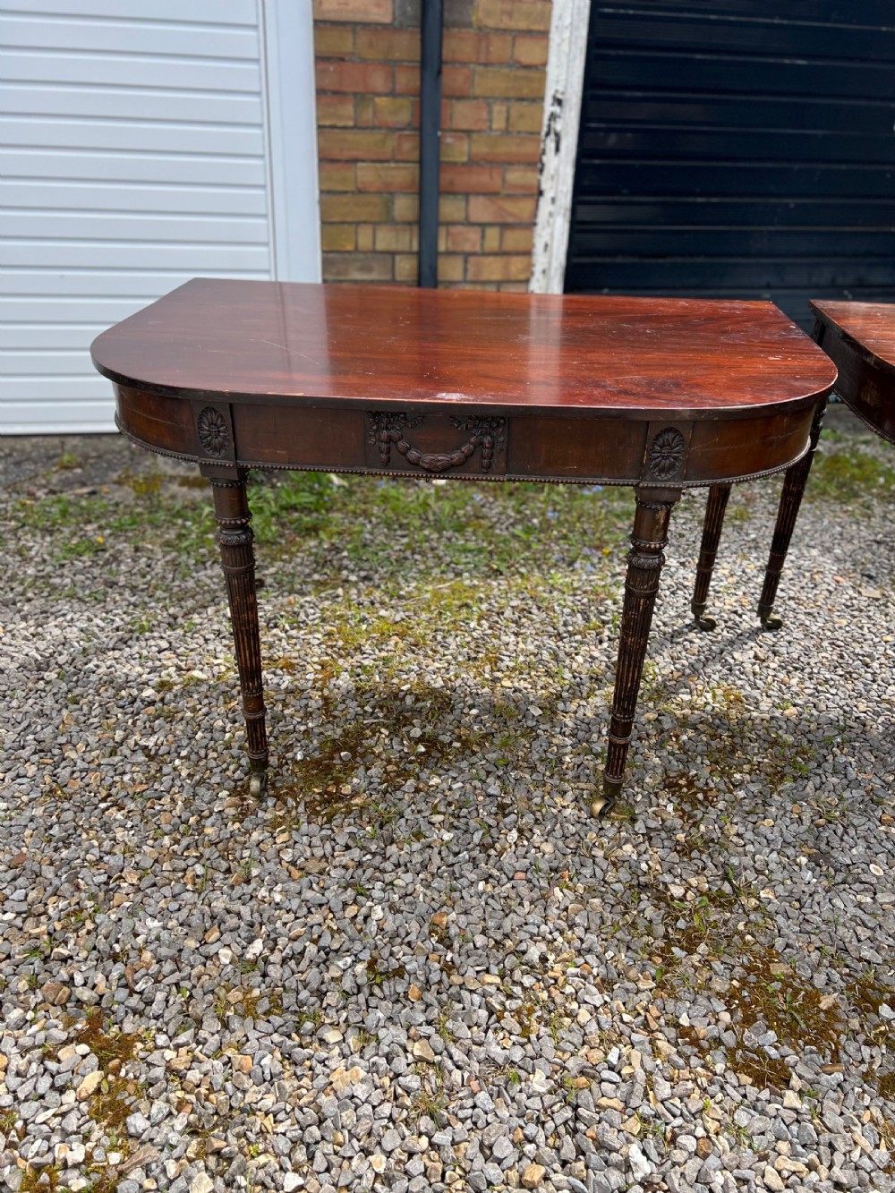 A pair of c1800 D end tables with ribbon swag carving and paterae View XI