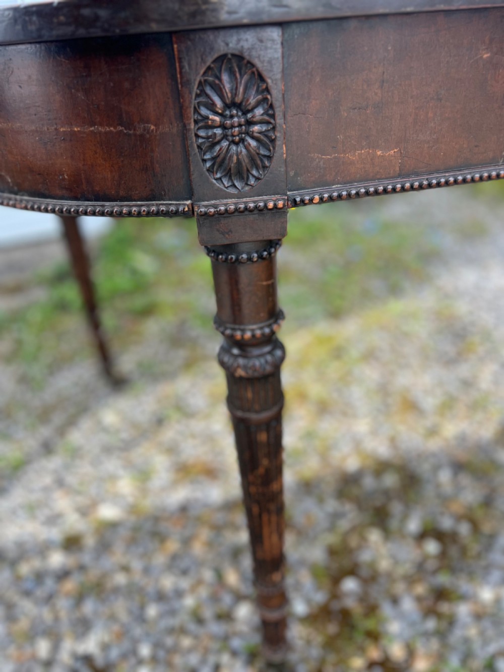 A pair of c1800 D end tables with ribbon swag carving and paterae View XVII