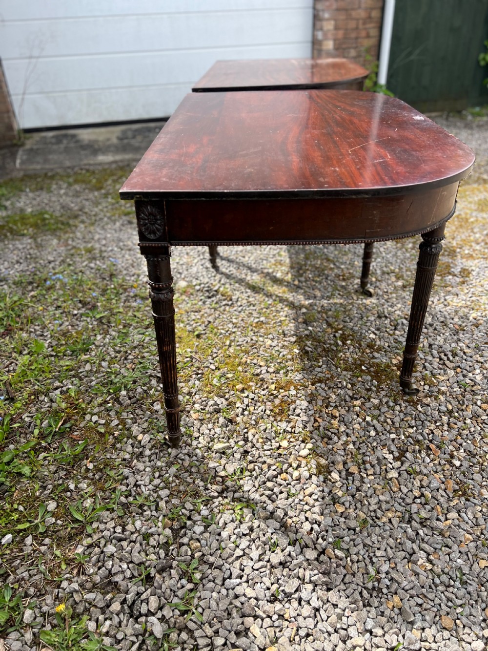 A pair of c1800 D end tables with ribbon swag carving and paterae View XVIII