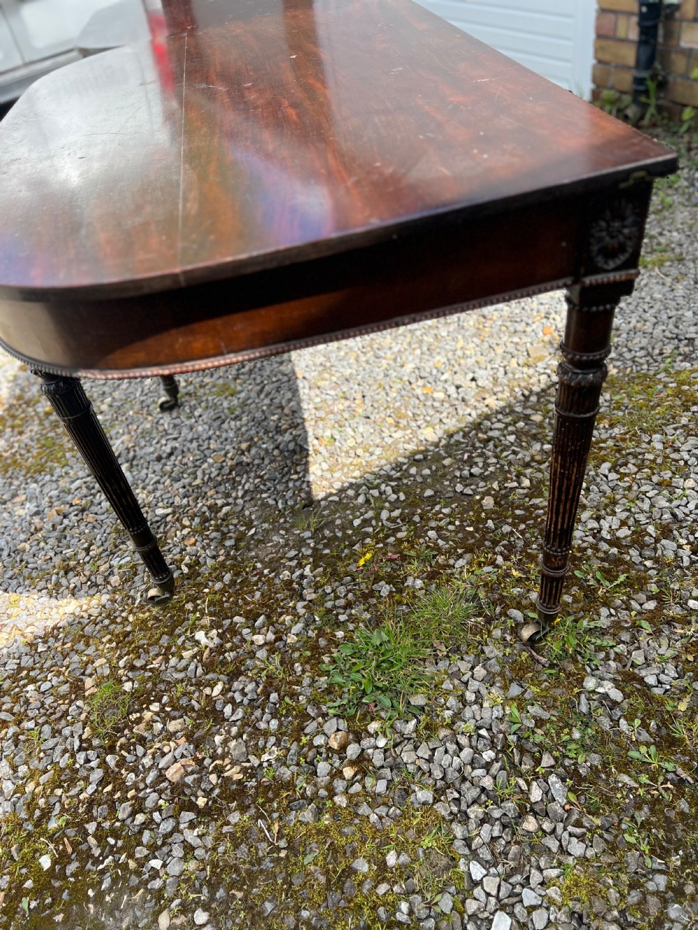 A pair of c1800 D end tables with ribbon swag carving and paterae View XXI