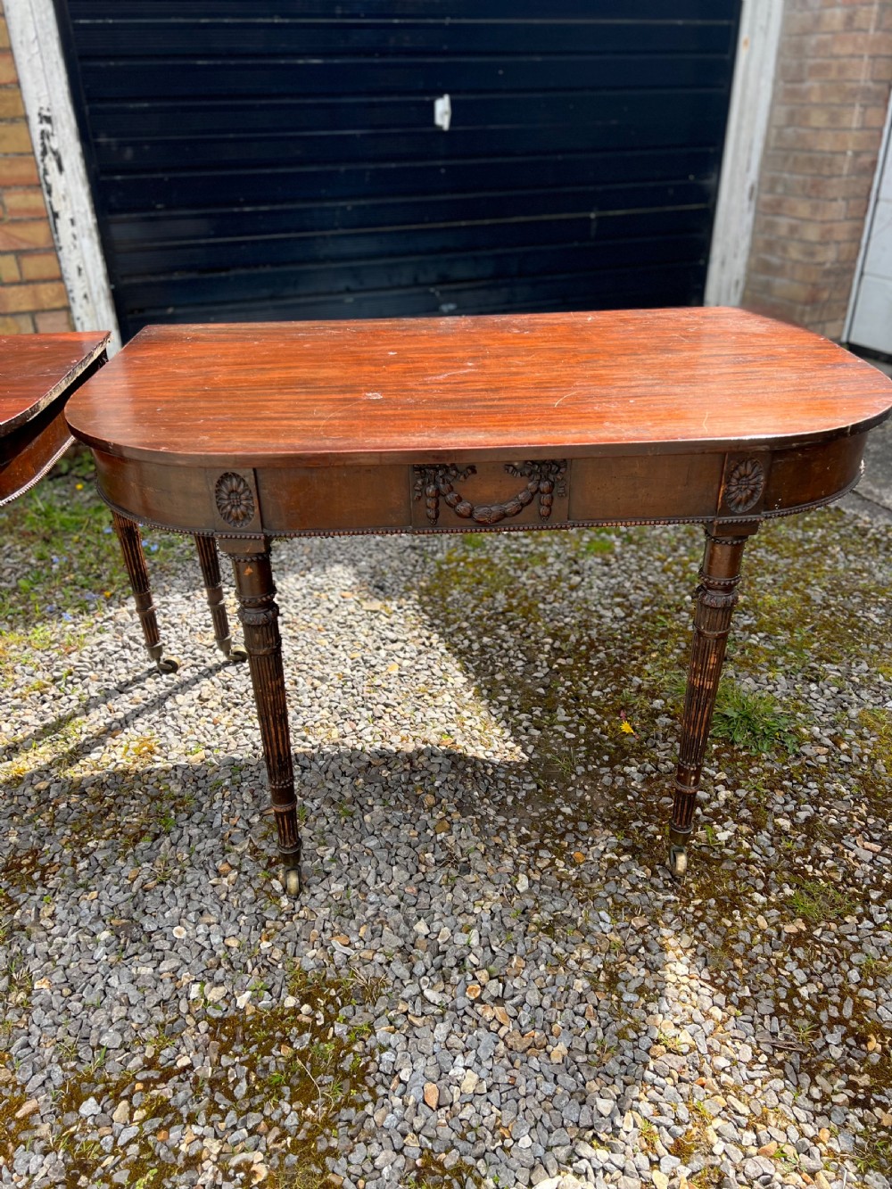 A pair of c1800 D end tables with ribbon swag carving and paterae View XXIII