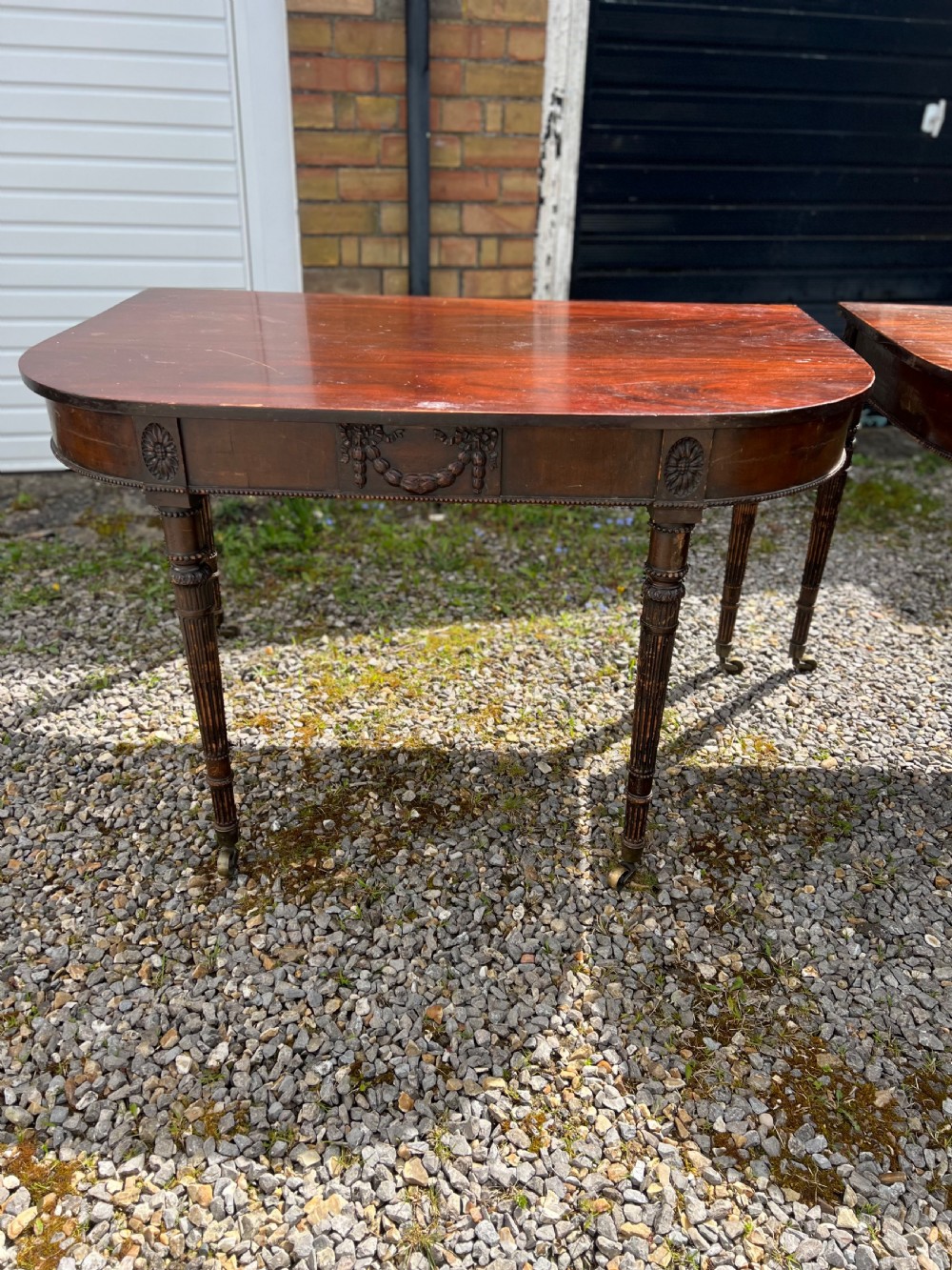 A pair of c1800 D end tables with ribbon swag carving and paterae View XXIV